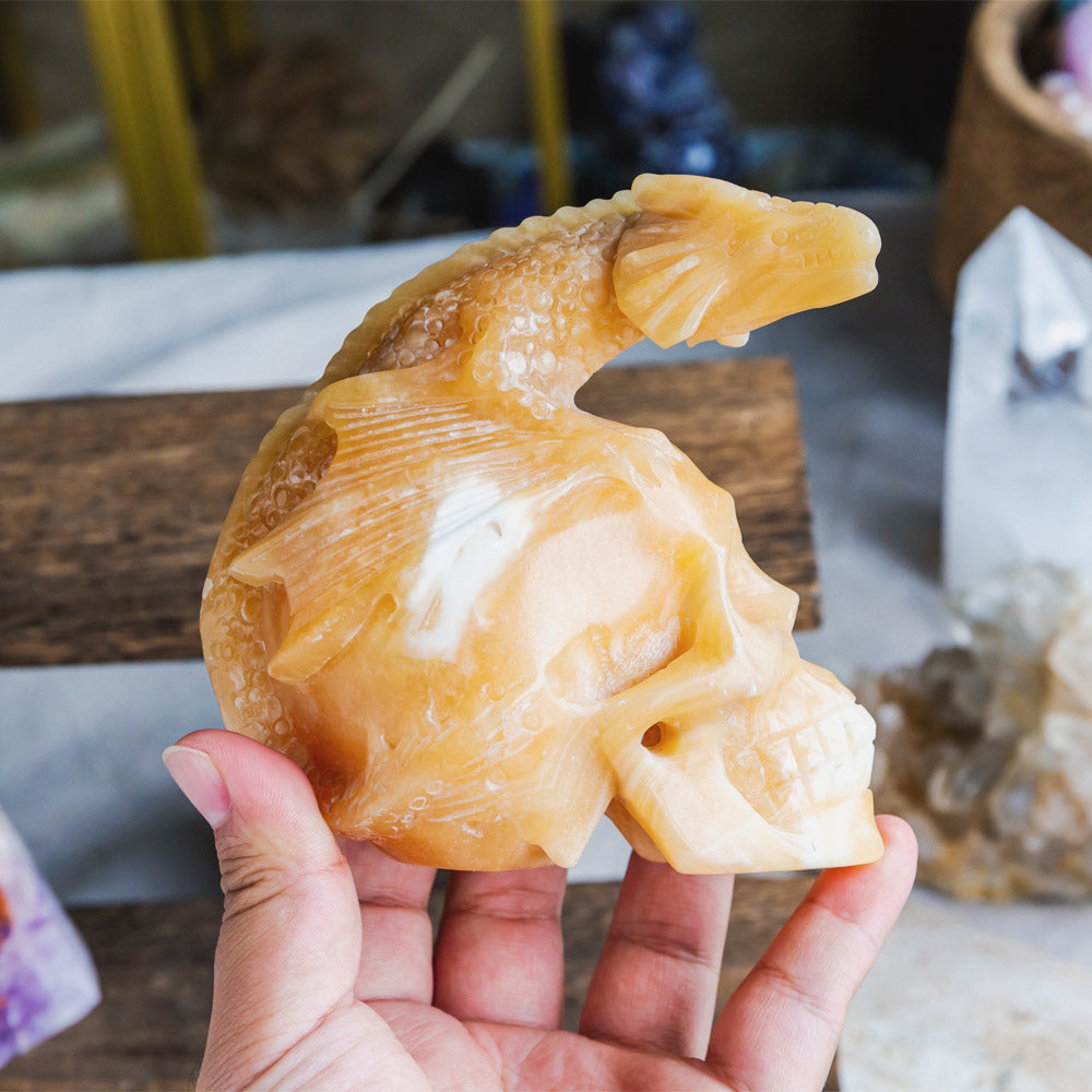 Orange Calcite Skull With Flying Dragon